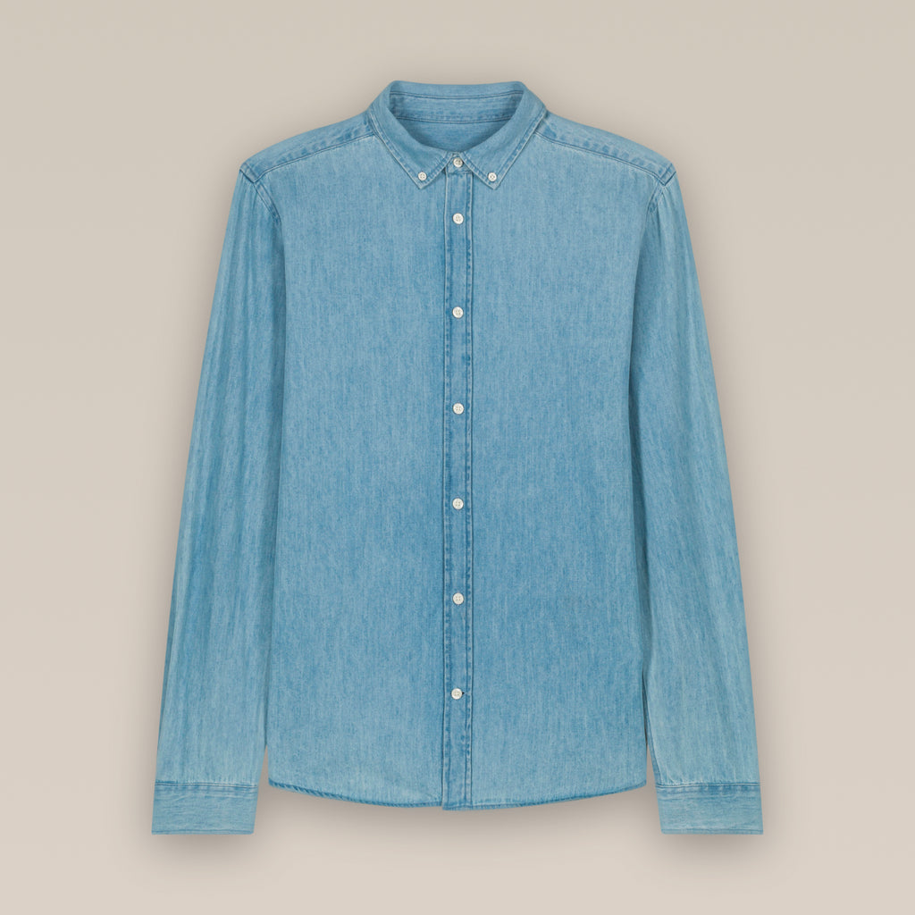 Light blue wash men's denim shirt laid flat against a neutral background