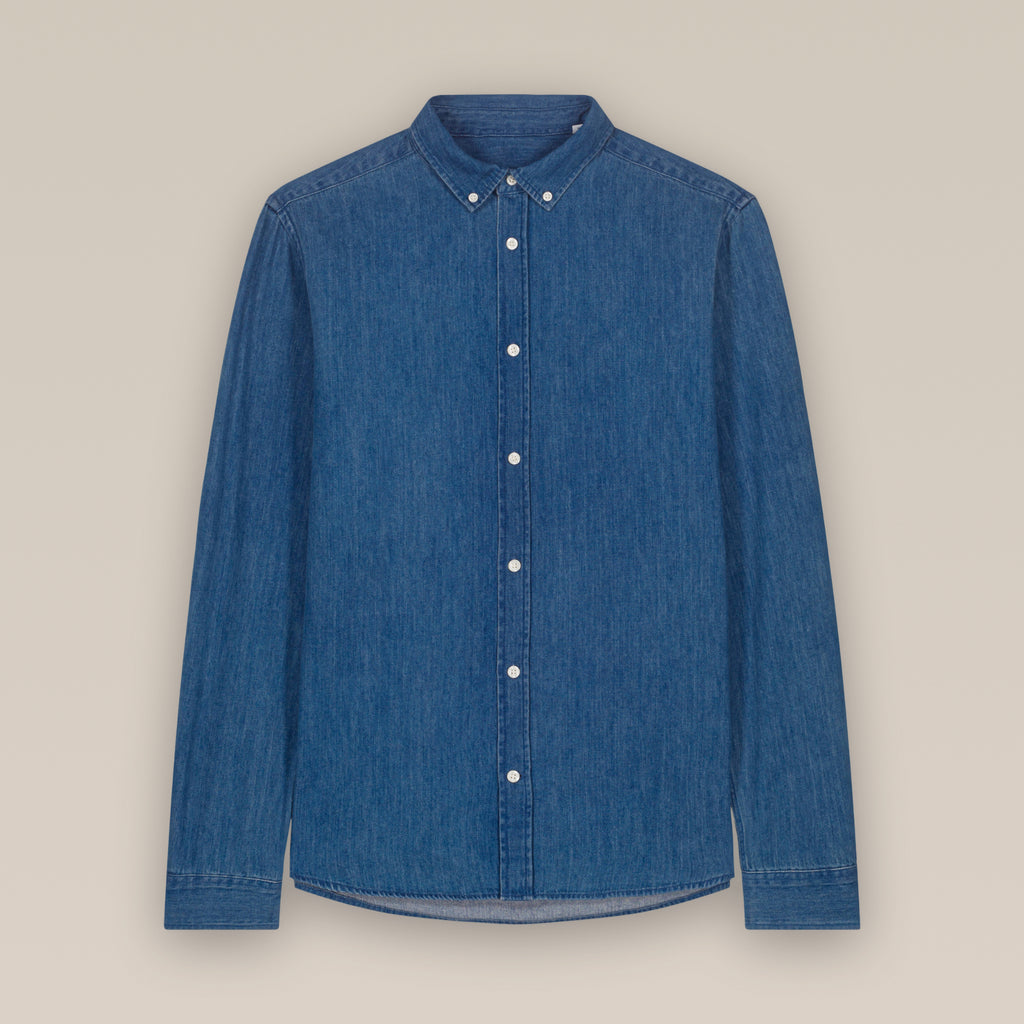 Mid wash blue men's denim shirt laid flat against a neutral background.