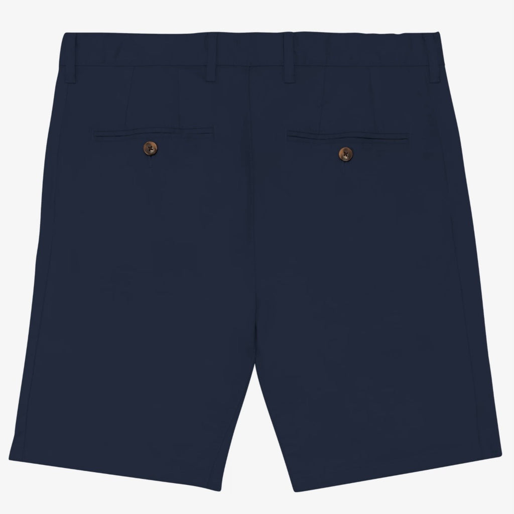 Back view of men's navy coloured chino shorts with recycled button closures on two back pockets, and belt loops, shown flat against a neutral background.