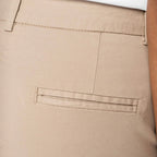 Close-up of the back of the women's sand dune coloured chino shorts showing the back waistband, belt loops, and a welt pocket.