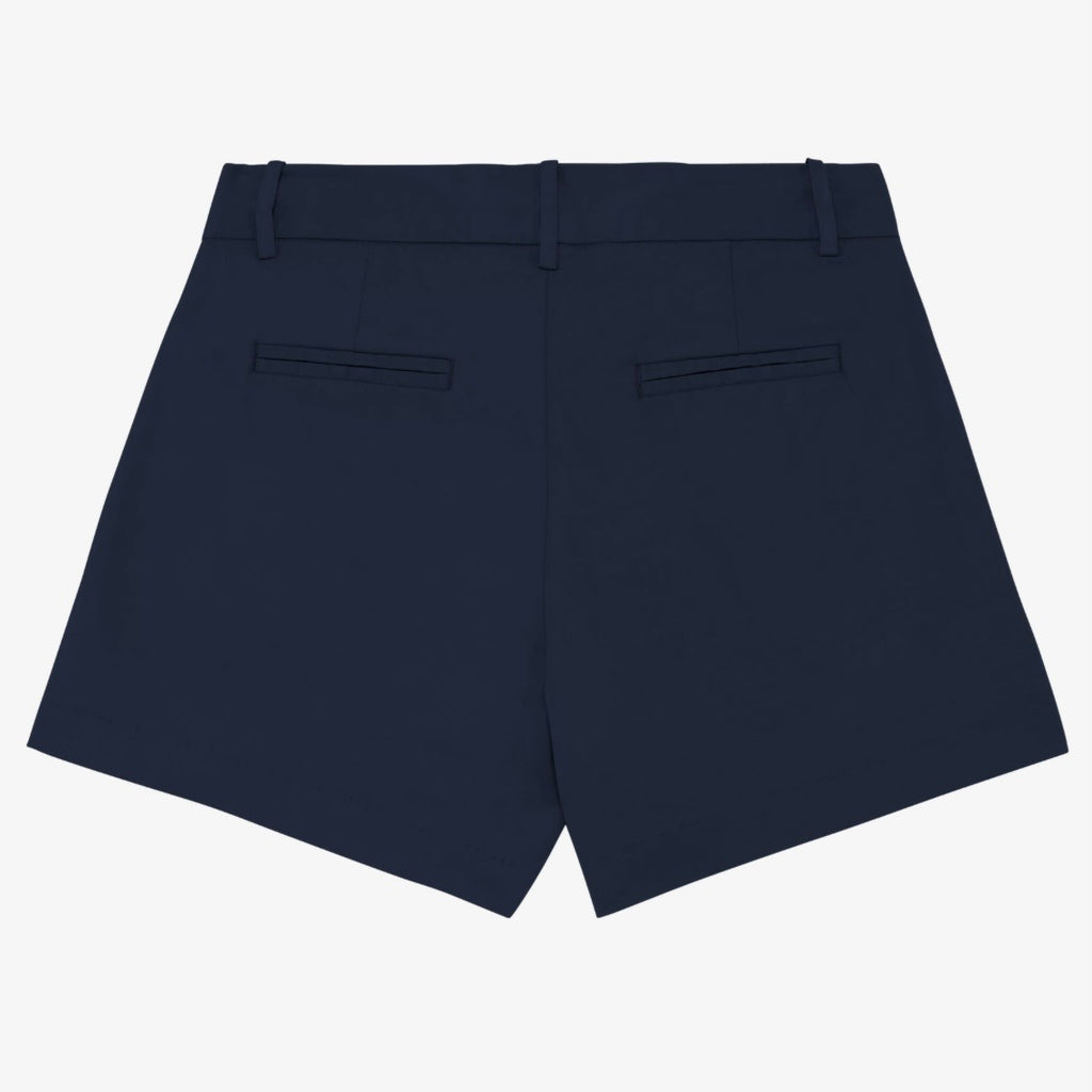Women's navy coloured chino shorts with a recycled button closure, and recycled metal zip, belt loops, and back pockets, shown flat against a neutral background.